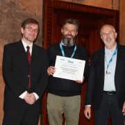 in the photo: Ralf Lehnert (awards committee chair, right), Andrea Tonello (middle), Jaromír Hrad (ISPLC 2019 general chair, left) at the ceremony in Prague at IEEE ISPLC on 4.3.2019.