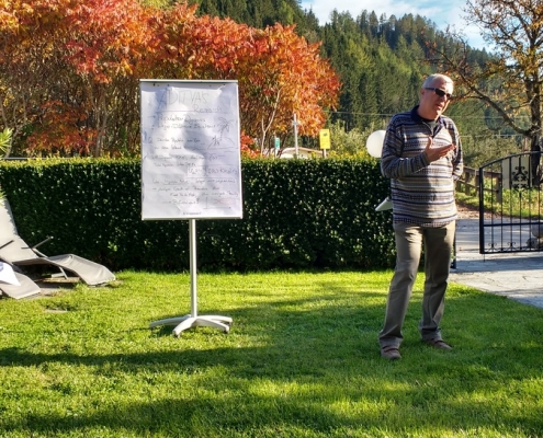 Professor Rendl Calmly Presenting Doctoral Student’s Research