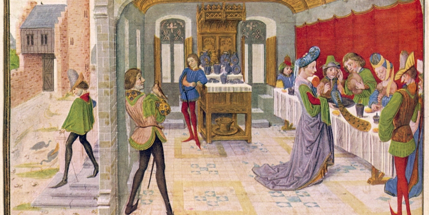 Personen bei einem mittelalterlichen Festmahl